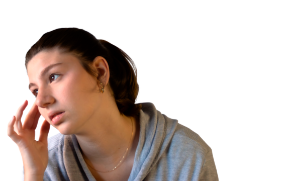 Young woman in a thoughtful pose against a light background, isolated. Teenage model with an emotional expression for creative campaigns
