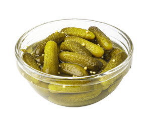 Glass bowl overflowing with delicious gherkins pickles on transparent background