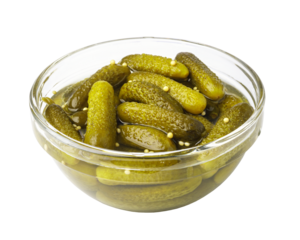 Glass bowl overflowing with delicious gherkins pickles on transparent background