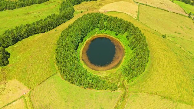 Pond Pau Pique and Lush Green Pastureland. Azores, Sao Miguel Island. Portugal. Aerial High Angle Shot. Orbiting
