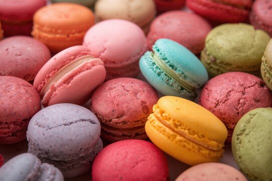 Vibrant assortment of sweet, colorful macarons in close-up.