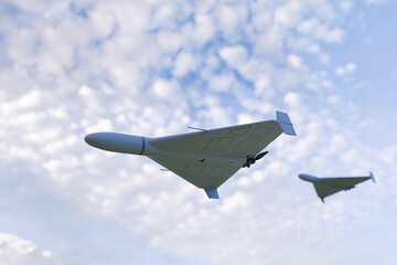 Two military drones flying in the sky with scattered clouds, showcasing modern unmanned aerial vehicle technology used for surveillance, reconnaissance, and defense operations. Military drone flies