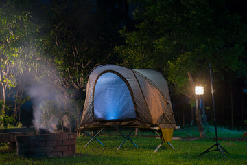 Camping tent in the forest, falling leaves in winter  in a forest camping area