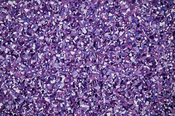 Textured surface with colorful flake particles on resin floor