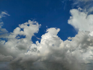 Towering Cumulus Clouds in Deep Blue Sky