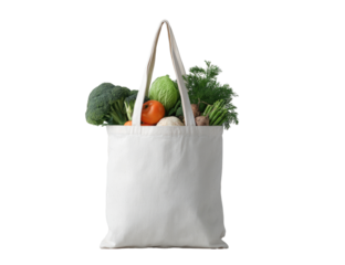 A plain, off-white canvas tote bag filled with assorted fresh produce