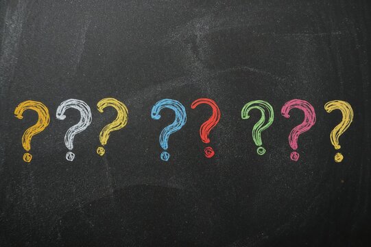 Brightly colored question marks in the backdrop, close-up view - Powered by Adobe