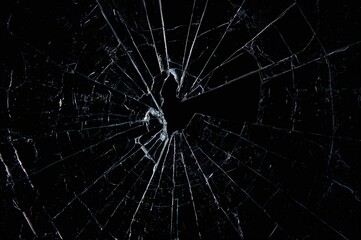 Obraz premium Shattered glass set against a dark backdrop