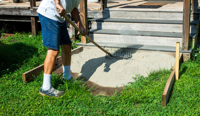 Spreading cement with rake