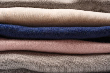 A group of warm sweaters isolated on a white background.