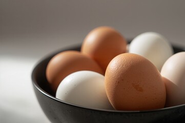 Macro shot of eggs in a dark bowl honoring egg appreciation day