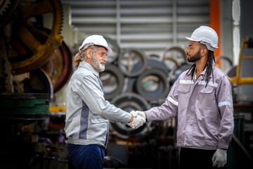 Technician industrial worker inspecting aluminum metal sheet fabricating roll check stock materials...