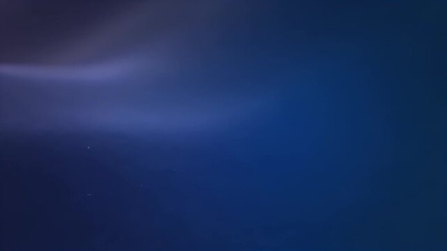 Ethereal Deep Blue Abstract Background with Soft Luminous Streaks and Subtle Gradient Texture; Dark Sapphire and Indigo Hues with Gentle Light Flar...
