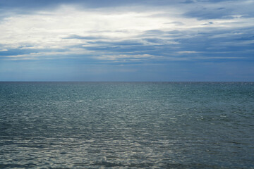 Seascape in Corfu Greece. Blue sea and sky with clouds. Natural background
