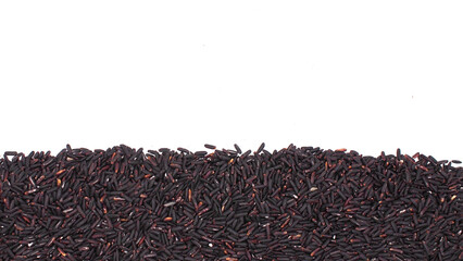 Horizontal layer of riceberry rice grains on white background. Suitable for food advertising,...