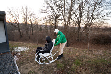 Morning tranquility unfolds as two individuals enjoy a moment on a rocking chair near a serene...