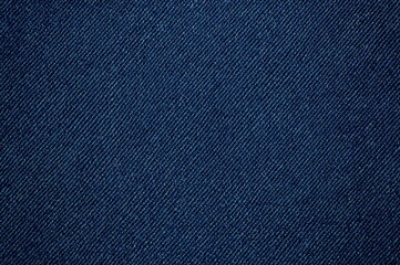 Close-up of raw denim fabric texture with blue jeans detail