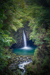 Hidden (secret) Waterfall in the volcanic terrain with columnar joint and river cave (corrasional cave), Hantan River, Dove's Pocket (nest) Waterfall, South Korea