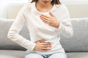 Acid reflux disease, suffer asian young woman have symptom gastroesophageal, esophageal, stomach...