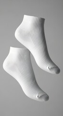 Minimalist white ankle socks floating against a neutral gray background, perfect for fashion and lifestyle concepts