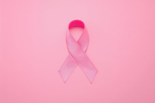Symbolic bow in awareness colors for breast cancer support campaign highlighting life with tumor