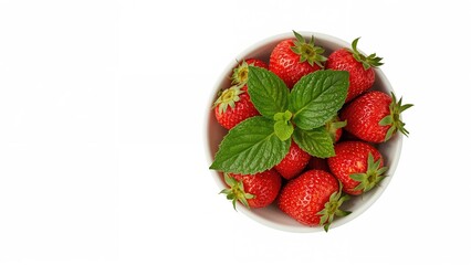 Top-down view of a bowl filled with ripe strawberries and a single green leaf on a white surface