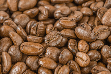 Roasted coffee beans as a background macro photo.