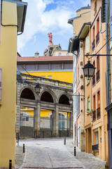 View through an old street to the Mary statue in Le Puy-en-Velay, France