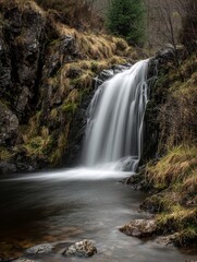 Fototapeta premium Majestic Waterfall in Long Exposure A Stunning Display of Natures Power and Beauty