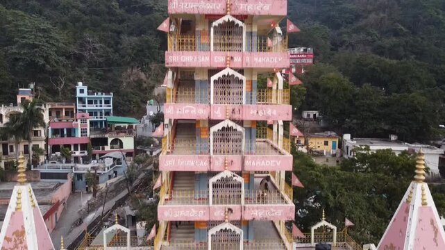 Rishikesh, Uttrakhand, India - October 10th 2024 - ​Trayambakeshwar Temple, also known as the Tera Manzil Temple. A vibrant architectural wonder on the banks of the Ganges River.