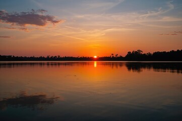 Obraz premium Gorgeous evening sky mirrored on the lake surface