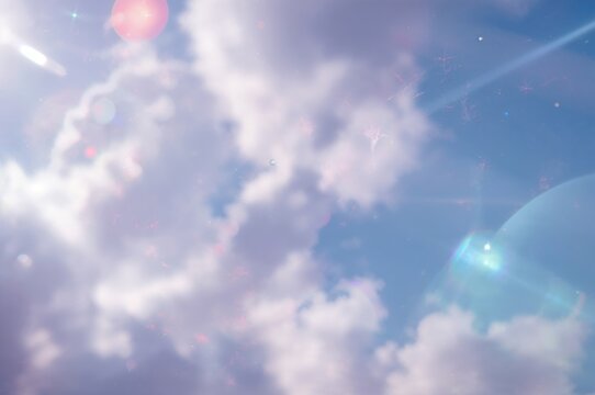 Soft blurred rainbow light flares as a background with double exposure effect and a hazy sky reflection in glass. Viva Magenta theme.