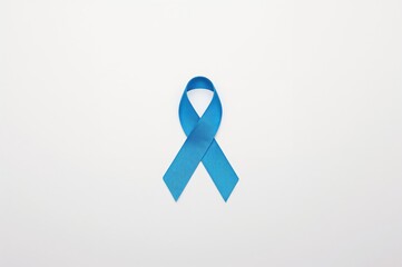 Top view of a blue awareness ribbon with a blank background and room for text