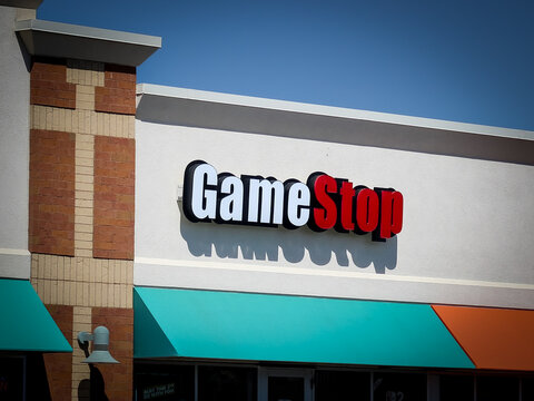 A GameStop sign on a store in a suburban Minnesota mall. GameStop (GME) is an American multinational video game, consumer electronics, and gaming merchandise retailer (May 2025).