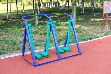Fototapeta premium The fitness equipment in the park, the two-person walking machine