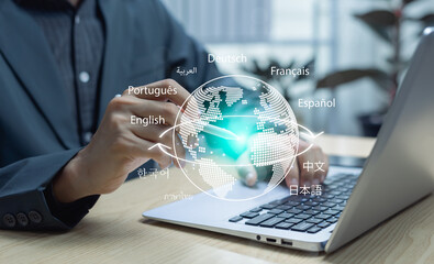 Businessman using laptop translator app for language education, translating foreign languages,...