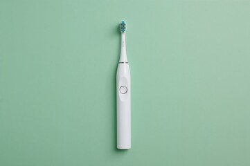 Contemporary electric toothbrush against a green backdrop. Celebrating dental professionals' day