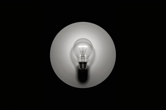 Light bulb icon inside a white circle casting a lengthy shadow