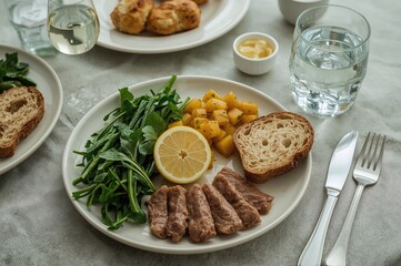 To maintain good health, incorporate diverse vegetables like leafy greens along with meat, bread, and lemon for a balanced and nutritious dish.