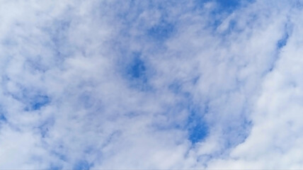 Fluffy White Clouds Against a Clear Blue Sky