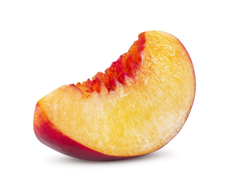 Unpitted, smooth-skinned nectarine fruit slice isolated on white background with copy space for text or images. Close-up shot.