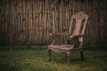 Vintage wooden armchair set against a bamboo fence backdrop for a relaxing atmosphere