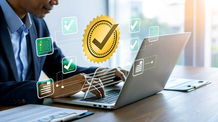 Businessman using laptop with quality assurance graphic, symbolizing product guarantee and iso standard certification, ensuring best service and approval