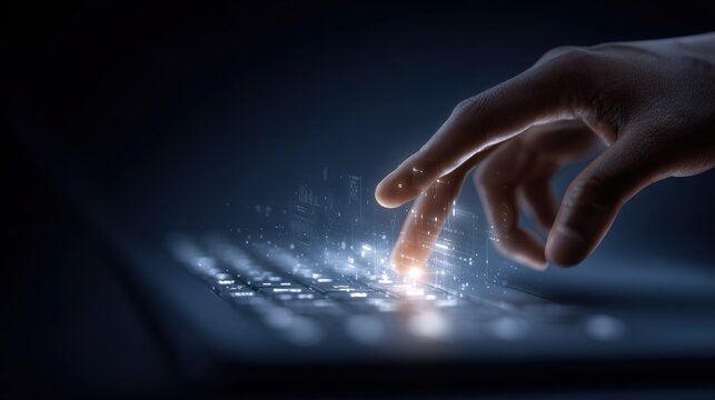 Close-up of a human hand interacting with a holographic digital interface on a laptop keyboard