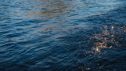 Calm waters ripple softly near the dock, illuminated by shimmering sunlight, evoking a tranquil and serene mood.