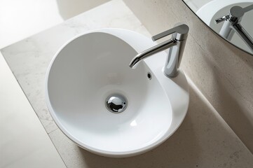 Fototapeta premium Standalone sink with a shiny metal tap