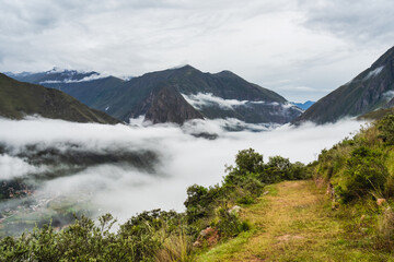 Scenic dramatic landscape of the Andes Mountains captured from the Chicaqata Hike leading to the Inti Punku Sun Gate near Ollantaytambo, Peru.