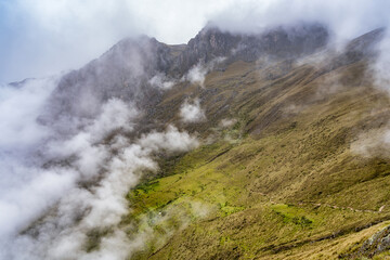 Scenic dramatic landscape of the Andes Mountains captured from the Chicaqata Hike leading to the Inti Punku Sun Gate near Ollantaytambo, Peru.