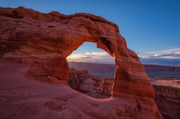 The Sunset Arch is located within a vast protected area known for its grand staircases and unique rock formations.