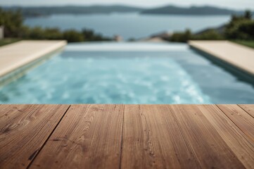 Blurred swimming pool backdrop with an empty wooden surface in the foreground